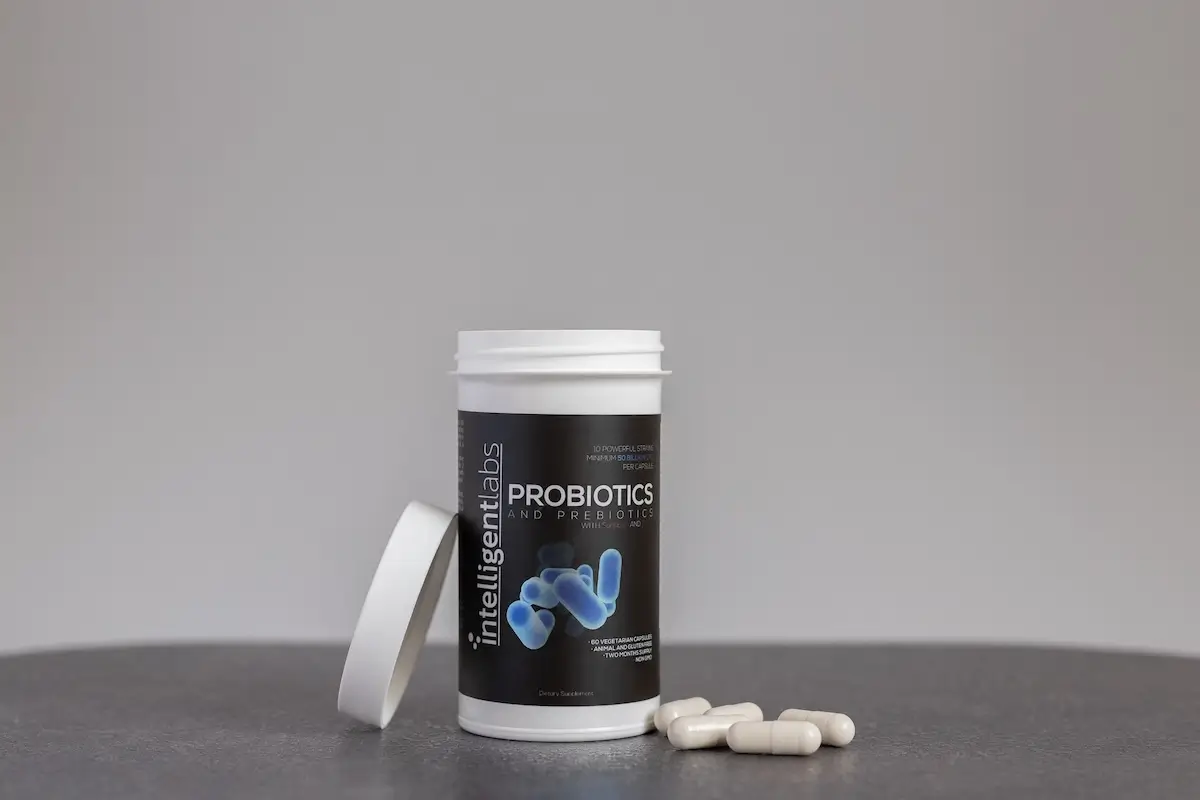 open bottle of probiotics with capsules